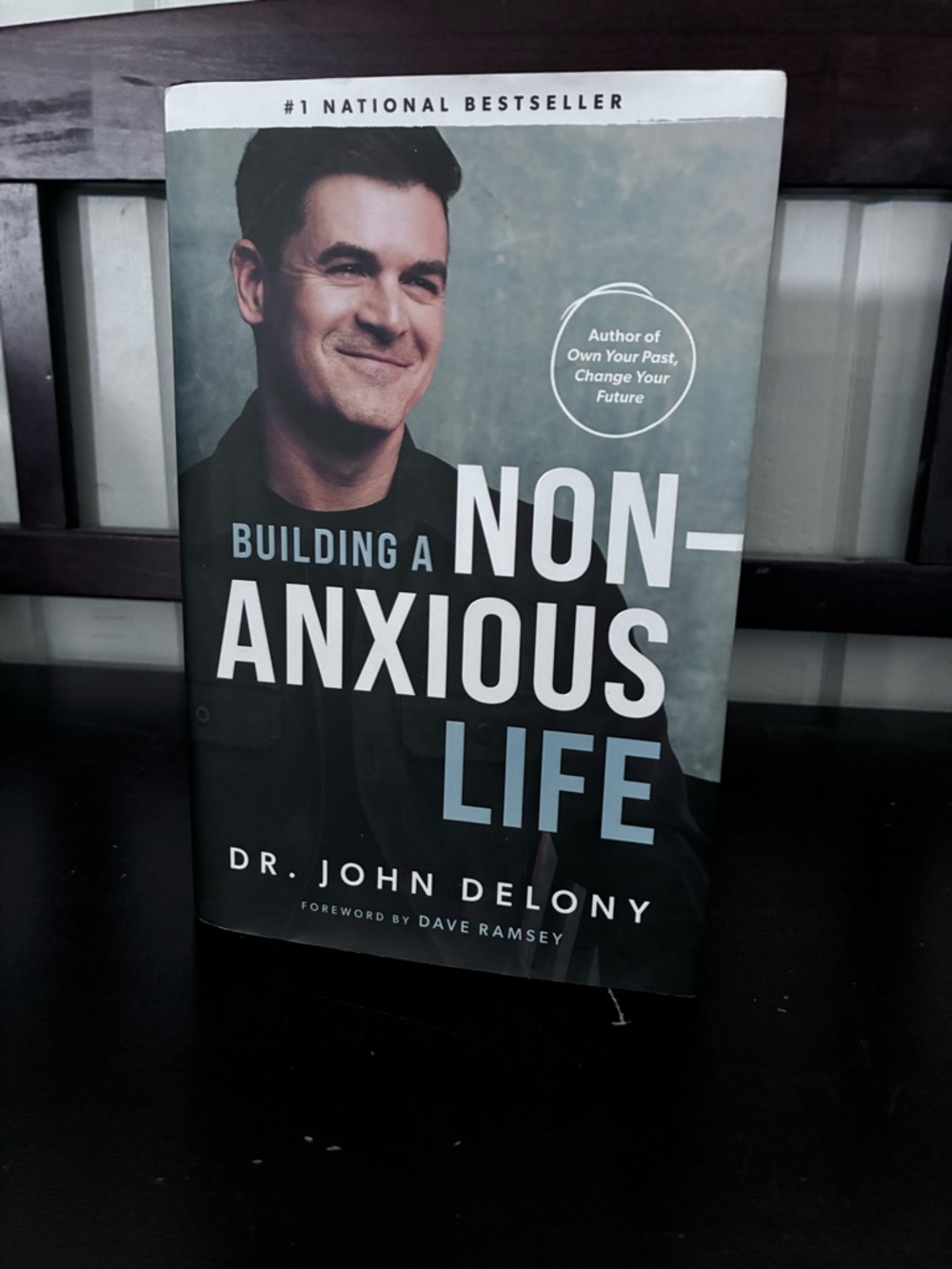 Building a Non-Anxious Life by Dr. John Delony - Teal & Black Cover